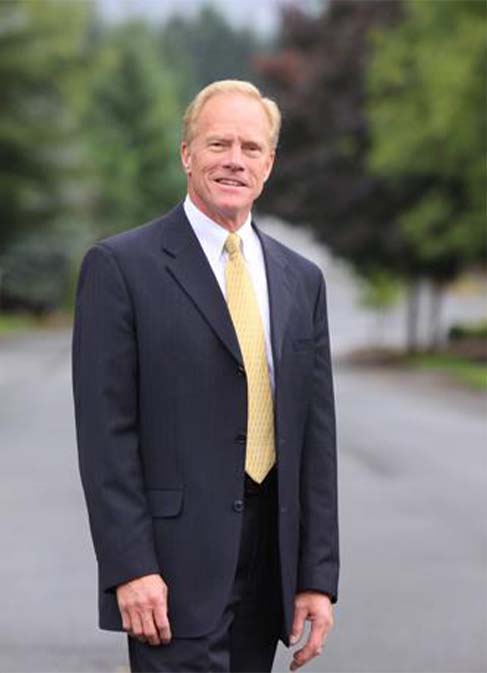 Paul Harris standing on a street outside